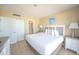 Relaxing bedroom with a plush bed and adjacent bathroom and closet at 4800 S Ocean Blvd. # 504, North Myrtle Beach, SC 29582