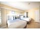 Cozy bedroom with two beds, wall art and a closet at 4800 S Ocean Blvd. # 504, North Myrtle Beach, SC 29582