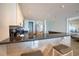 Open-concept kitchen with stainless steel appliances and granite bar at 4800 S Ocean Blvd. # 504, North Myrtle Beach, SC 29582