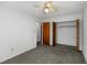Bedroom with neutral walls and carpet flooring, showcasing a closet and ceiling fan at 500 Fairway Village Dr. # 3-L, Myrtle Beach, SC 29588