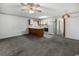 Open-concept living area with an eat-in kitchen, carpet floors, and white appliances at 500 Fairway Village Dr. # 3-L, Myrtle Beach, SC 29588