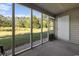 A screened porch with gravel and greenery views at 500 Fairway Village Dr. # 3-L, Myrtle Beach, SC 29588