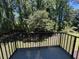 Outdoor balcony offering views of a lush green backyard and mature trees at 5001 Little River Rd. # W-211, Myrtle Beach, SC 29577