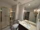 Bathroom featuring grab bars, a glass shower, and a single vanity at 5001 Little River Rd. # W-211, Myrtle Beach, SC 29577