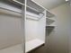 Spacious walk-in closet with built-in shelving and ample storage space at 5001 Little River Rd. # W-211, Myrtle Beach, SC 29577