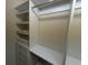 Custom closet with shelving, drawers, and hanging rods for maximum organization at 5001 Little River Rd. # W-211, Myrtle Beach, SC 29577