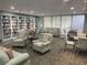 Cozy community library space with large bookshelves, comfortable seating, and natural light at 5001 Little River Rd. # W-211, Myrtle Beach, SC 29577