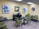 Lobby area with contemporary decor, including blue floral paintings at 5001 Little River Rd. # W-211, Myrtle Beach, SC 29577