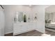 Bright bathroom featuring a double vanity with white cabinets and decor, and an open doorway at 5141 Yellowstone Dr., Conway, SC 29526