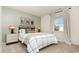 Bright bedroom with patterned wallpaper, a comfortable bed, soft textures, and a large window at 5141 Yellowstone Dr., Conway, SC 29526