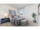 Bedroom with a plush bed, neutral-toned decor, stylish side tables, complemented by plenty of natural light at 5141 Yellowstone Dr., Conway, SC 29526