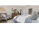 Comfortable bedroom featuring a plush chair, wooden dresser, and a bed with soft textures at 5141 Yellowstone Dr., Conway, SC 29526