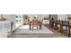 Bright dining room featuring modern decor, a wood dining table, and seamless access to the kitchen and living room at 5141 Yellowstone Dr., Conway, SC 29526