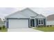 Charming single-Gathering home featuring a two-car garage and a mix of lap siding and shingles on the facade at 5141 Yellowstone Dr., Conway, SC 29526
