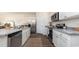 Bright kitchen featuring white cabinets, stainless steel appliances, granite countertops, and modern fixtures at 5141 Yellowstone Dr., Conway, SC 29526