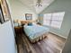 Cozy bedroom with neutral paint, light wood flooring, and ample natural light at 6001-1168 S Kings Hwy., Myrtle Beach, SC 29575