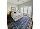 Relaxing main bedroom featuring a large window, plush bedding, and stylish decor at 6001-1168 S Kings Hwy., Myrtle Beach, SC 29575