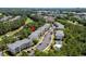 Condominiums with community pool surrounded by lush trees and green grass at 6015 Catalina Dr. # 534, North Myrtle Beach, SC 29582
