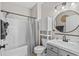 Well-lit bathroom featuring a bathtub, shower, and modern vanity with round mirror at 6015 Catalina Dr. # 534, North Myrtle Beach, SC 29582