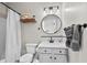 Elegant bathroom featuring a vanity with a round mirror and a tiled backsplash at 6015 Catalina Dr. # 534, North Myrtle Beach, SC 29582