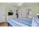 Comfortable bedroom with a ceiling fan and access to a bathroom at 6015 Catalina Dr. # 534, North Myrtle Beach, SC 29582