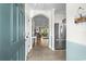Inviting foyer with tile flooring, an arched doorway, and a view into the open living area with stainless steel appliances at 6015 Catalina Dr. # 534, North Myrtle Beach, SC 29582