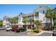 Attractive condo building with palm trees and private balconies at 6015 Catalina Dr. # 534, North Myrtle Beach, SC 29582