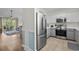 Stainless steel refrigerator stands out in the kitchen with white cabinets and stainless steel appliances at 6015 Catalina Dr. # 534, North Myrtle Beach, SC 29582