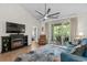 Spacious living room featuring a fireplace, balcony access, and access to the adjacent bedroom at 6015 Catalina Dr. # 534, North Myrtle Beach, SC 29582