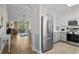A view of the living area adjacent to the kitchen, which features stainless steel appliances and ample cabinet space at 6015 Catalina Dr. # 534, North Myrtle Beach, SC 29582