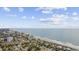 Aerial view of the beach and nearby homes with ocean views at 6501 Somerset Dr., Myrtle Beach, SC 29572