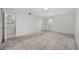 Spacious bedroom featuring white walls, carpet, a window, and access to the bathroom at 6501 Somerset Dr., Myrtle Beach, SC 29572