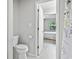 Bathroom view offers neutral walls, toilet and access to the bedroom at 6703 Jefferson Pl. # B7, Myrtle Beach, SC 29572