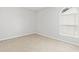 This bedroom features carpet flooring, natural light, and neutral walls at 6703 Jefferson Pl. # B7, Myrtle Beach, SC 29572