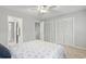 This bedroom offers carpet flooring, white walls, closet space and access to the hallway at 6703 Jefferson Pl. # B7, Myrtle Beach, SC 29572
