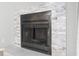 Close up of fireplace with grey tiled surround and access to the backyard at 6703 Jefferson Pl. # B7, Myrtle Beach, SC 29572
