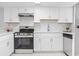 Modern kitchen with white cabinets, stainless steel appliances, and stylish countertops at 6703 Jefferson Pl. # B7, Myrtle Beach, SC 29572