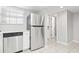 Galley kitchen featuring stainless steel appliances and tiled flooring at 6703 Jefferson Pl. # B7, Myrtle Beach, SC 29572