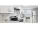 Kitchen with stainless appliances, white cabinets, and undermounted sink at 6703 Jefferson Pl. # B7, Myrtle Beach, SC 29572