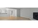 Open-concept living space with wood floors, a fireplace, and a view into the adjacent kitchen area at 6703 Jefferson Pl. # B7, Myrtle Beach, SC 29572