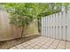 Enclosed back patio shows privacy fence and mature trees at 6703 Jefferson Pl. # B7, Myrtle Beach, SC 29572