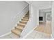 Interior view of carpeted stairs leading to the upper level of the home at 6703 Jefferson Pl. # B7, Myrtle Beach, SC 29572