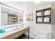 Bright bathroom featuring a vanity with a lighted mirror, a toilet, and a bathtub with shower at 7100 N Ocean Blvd. N # 601, Myrtle Beach, SC 29572