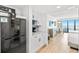Condo interior with kitchenette, eating area, and a beach view at 7100 N Ocean Blvd. N # 601, Myrtle Beach, SC 29572