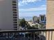 Beautiful ocean view from the balcony overlooking parking and nearby buildings at 7500 N Ocean Blvd. # 6061, Myrtle Beach, SC 29572