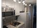 Efficient kitchenette featuring modern microwave, sink, and compact refrigerator at 7500 N Ocean Blvd. # 6061, Myrtle Beach, SC 29572