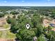 Aerial view of a neighborhood in a wooded area with blue sky at 752 Tall Oaks Ct., Myrtle Beach, SC 29588