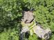 Aerial view of an octagonal house with mature trees on the property at 752 Tall Oaks Ct., Myrtle Beach, SC 29588