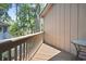Private balcony with wood flooring and railings, overlooking a lush green space at 752 Tall Oaks Ct., Myrtle Beach, SC 29588
