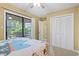 Bedroom with glass sliding doors leading to a patio, a ceiling fan and closet at 752 Tall Oaks Ct., Myrtle Beach, SC 29588